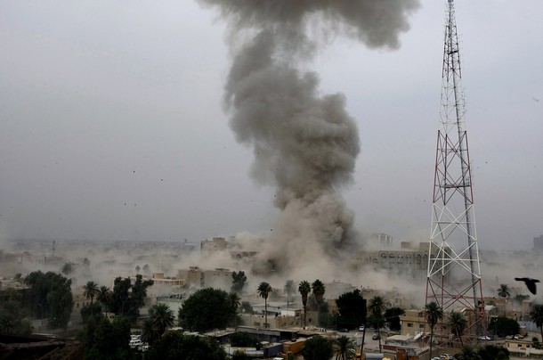 DV595631 Smoke billow following a blast close to the Justice Ministry in central Baghdad on October 25, 2009. Twin suicide vehicle bombs blamed on Al-Qaeda blast the justice ministry and a provincial office in Baghdad, killing at least 99 people and sparking turmoil in the embattled Iraqi capital. AFP PHOTO / SABAH ARAR / Getty Images